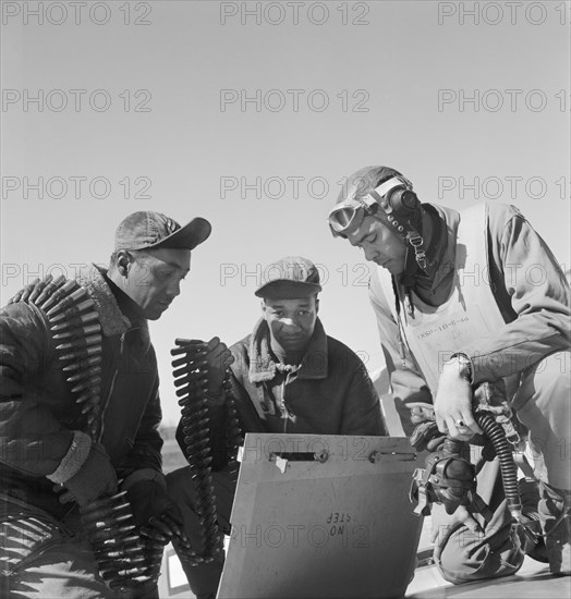 Tuskegee Airmen, left to right, Roscoe C. Brown, New York, NY, Class 44-C; Marcellus G. Smith, Louisville, KY; Col. Benjamin O. Davis, Ramitelli, Italy, Toni Frissell, March 1945