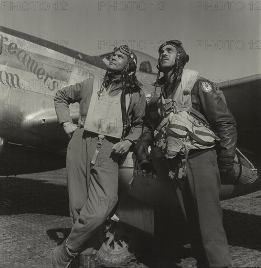 Tuskegee Airmen, Col. Benjamin O. Davis, Commanding Officer, 332nd Fighter Group, Class 42-C (left), Edward C. Gleed, Lawrence, KS, Class 42-K, Group Operations Officer (right), Full-length Portrait, P-5/D Airplane in Background, Ramitelli, Italy, Toni Frissell, March 1945