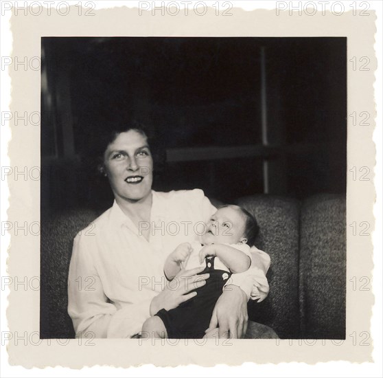 Smiling Mother Holding Infant Son, Circa 1950's