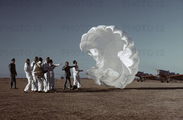 Instructor Explaining Operation of Parachute to Student Pilots, Meacham Field, Fort Worth, Texas, USA, Arthur Rothstein for Farm Security Administration, January 1942