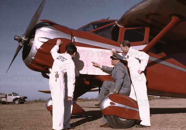 Instructor and Students Studying Map, Meacham Field, Fort Worth, Texas, USA, Arthur Rothstein for Farm Security Administration (FSA), January 1942