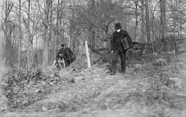 Policeman and Police Dog Waiting to Apprehend Thief, New York City, New York, USA, Bain News Service, 1912