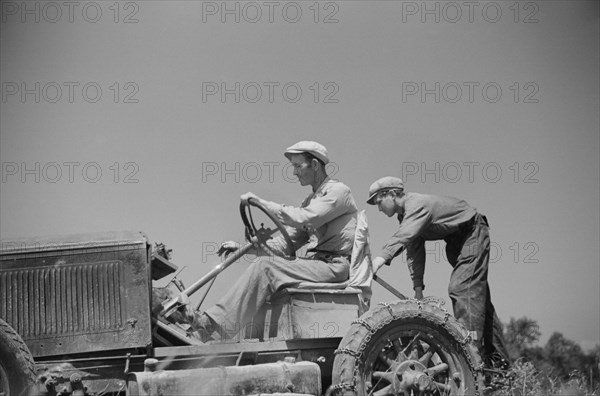 Luke Weldon, Small Farmer, and his son using Ancient Buick as Improvised Tractor. Automobile Purchased in Second-Hand Car Lot for Fifteen Dollars. New Bridgetown, New Jersey, USA, Edwin Rosskam, Farm Security Administration, June 1936