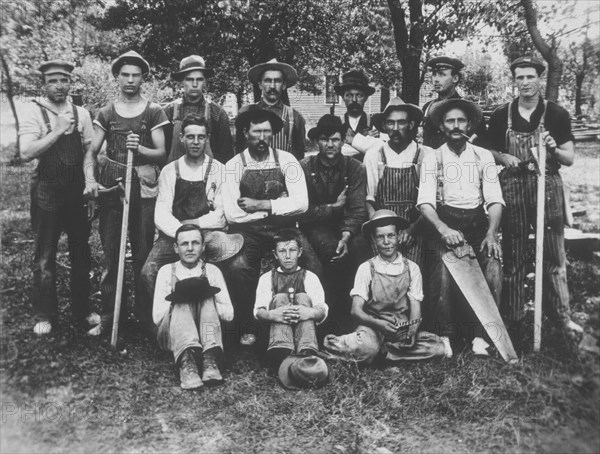 Group of Carpenters With Hammers and Saw, circa 1900