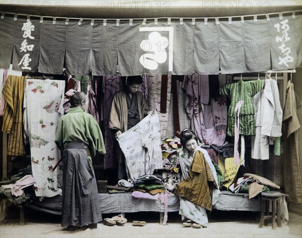 Japanese Street Vendor of Clothing, Hand Colored Albumen Photograph, circa 1880