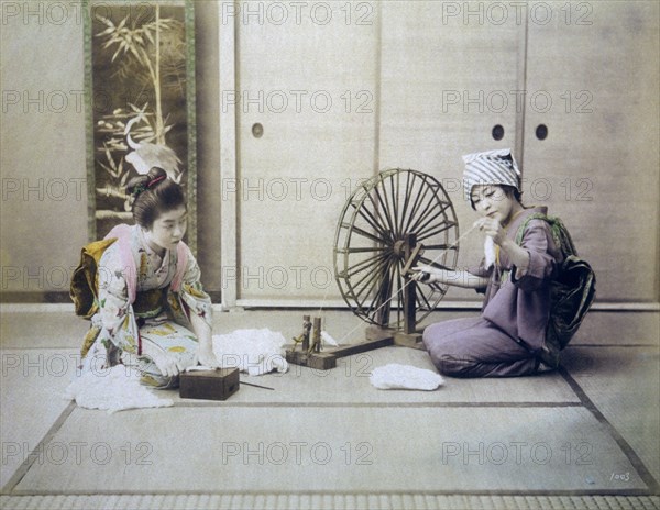Two Japanese Women Spinning Cotton, Hand Colored Albumen Photograph, circa 1880