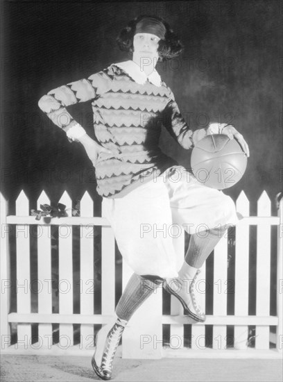 Women Dressed in Sports Attire and Holding Ball