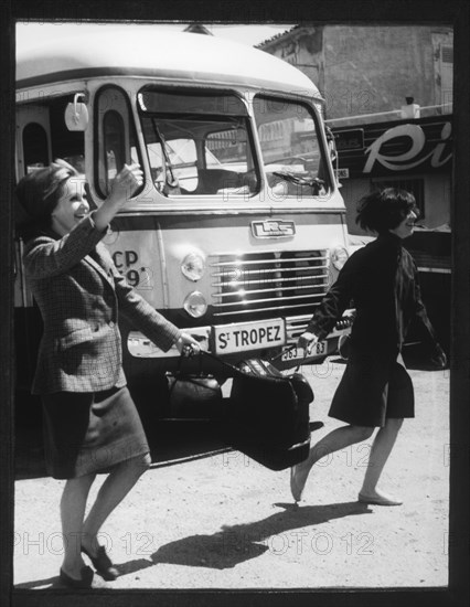 Women Crossing Street Carrying Suitcase, St. Tropez, France, 1965
