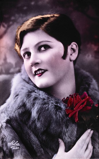 Smiling Woman in Fur Coat With Roses, circa 1900