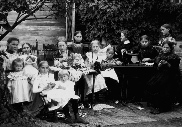 Group of Women and Children With Sewing Machine, Portrait, circa 1900