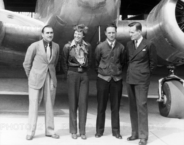 Amelia Earhart Standing With Paul Maas, Harry Manning and Fred Noonan in Front of her Lockheed Electra Airplane, Honolulu Airport, Hawaii, March 20, 1937