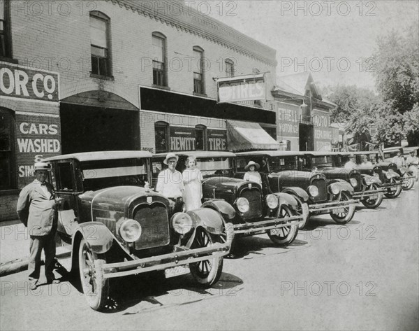 People Posed With Row of Automobiles, USA, 1921