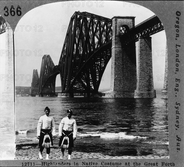 Two Male Highlanders in Native Costume Standing on the Bank of the Firth of Forth Near the Forth Rail Bridge, Queensferry, Scotland, Single Image of Stereo Card, circa 1900
