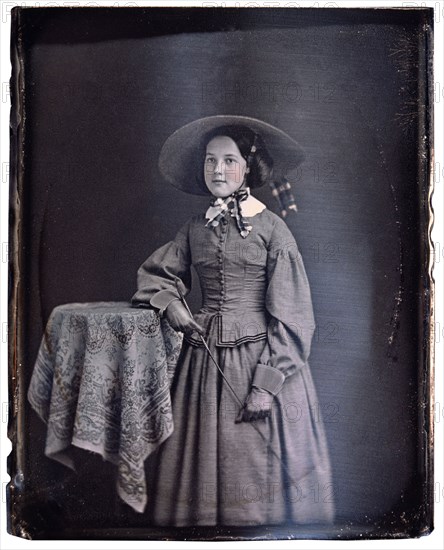 Young Woman in Long Dress and Large Floppy Hat with Riding Crop, Portrait, Daguerreotype, circa 1850's