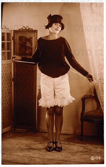 French Lingerie Model Lifting Dress to Reveal Bloomers, 1915