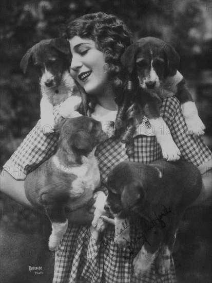 Mary Pickford with Four Puppies, circa 1910's
