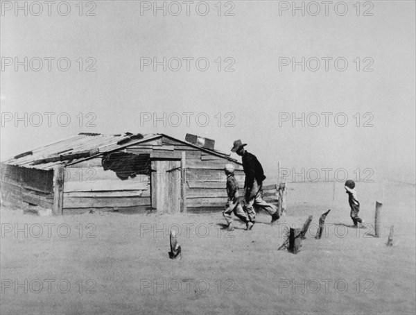 Farmer and his Two Sons During  Dust Storm, Cimarron County, Oklahoma, USA by Arthur Rothstein, 1936