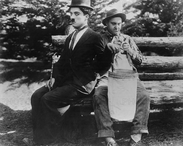 Charlie Chaplin and Billy Armstrong on-set of the Film, In the Park, 1915