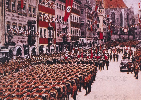 SA Troops Salute Adolf Hitler in Limousine During March Through Nuremberg, Germany, 1933