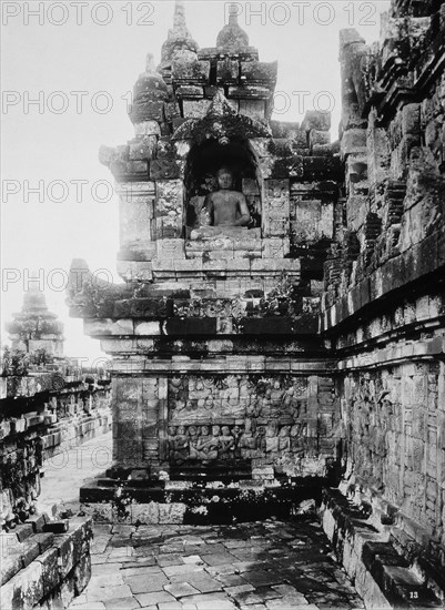 Statue of Buddha on First Platform, Borobudur Temple, Java, Indonesia, circa 1900