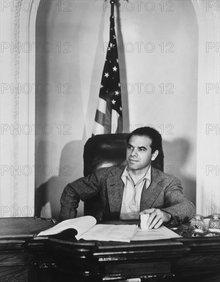 Frank Capra (1897-1991), American Film Director, Portrait behind Desk, circa 1930's