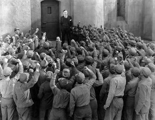 Walter Huston (center in Suit), on-set of the Film, "The Criminal Code" directed by Howard Hawks, 1931