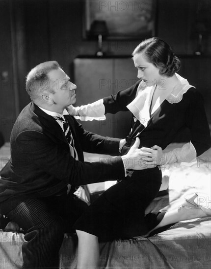 Wallace Beery and Joan Crawford, on-set of the Film, "Grand Hotel" directed by Edmund Goulding, 1932