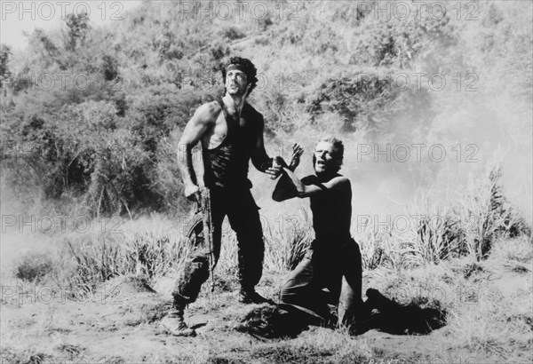 Sylvester Stallone and Unidentified Actor, on-set of the Film, "Rambo: First Blood Part II", 1985