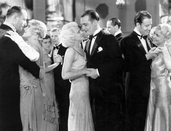 Jean Harlow and Walter Byron (center), on-set of the Film, "Three Wise Girls", 1932