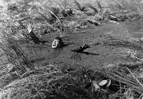 Man Sinking in Quicksand on-set of the Film, "Two Thousand Maniacs!", 1964