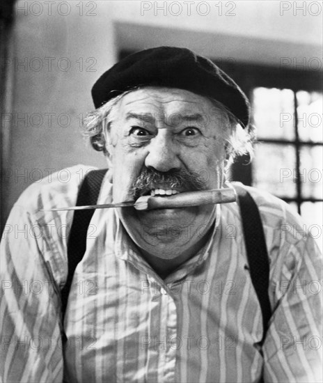 Michel Simon, Publicity Portrait with Knife between Teeth, on-set of the French Film, "The Two of Us" (aka Le Vieil Homme et L'Enfant), 1967