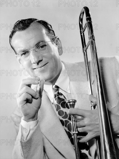 Glenn Miller, Portrait with Cigarette and Trombone, circa 1944