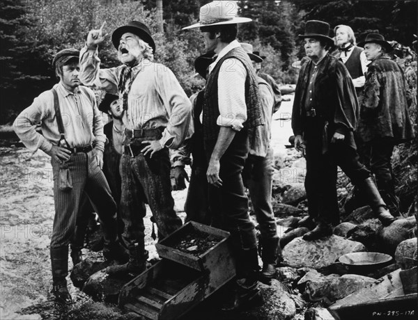 Lee Marvin (2nd Left), Clint Eastwood (3rd left), on-set of the Film, "Paint Your Wagon", 1969