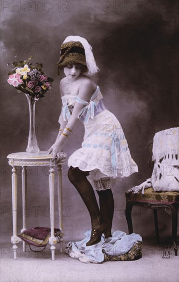 Lingerie Model Leaning on Table, circa 1920