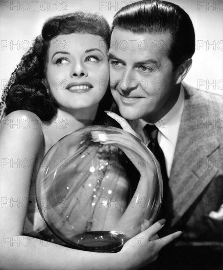 Paulette Goddard, Ray Milland, on-set of the Film, "The Crystal Ball", 1943