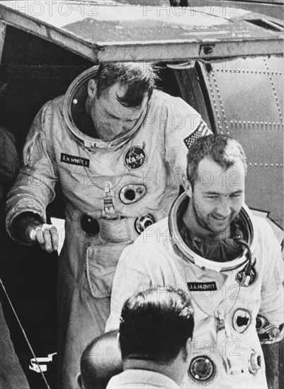 NASA Astronauts James McDivitt (front) and Edward White II Exiting Helicopter after Being Rescued from Ocean upon Completion of Gemini IV Space Mission, June 7, 1965