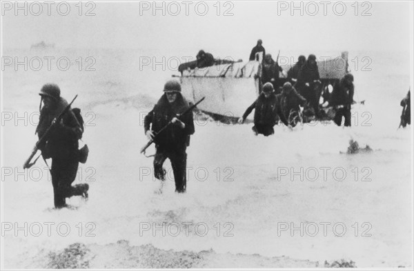 WWII U.S. Soldiers Disembarking Landing Craft on Beach, from the Documentary Film Series, "Why We Fight", Episode "War Comes to America", 1945