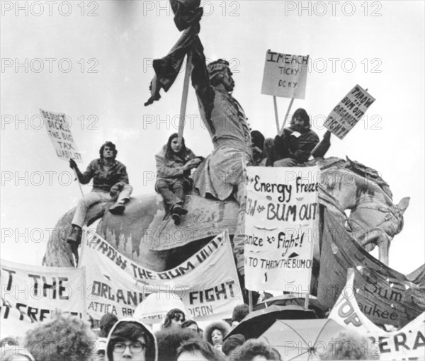 Protesters on Statue Outside Hilton Hotel Where President Richard Nixon was Speaking, Chicago, Illinois, USA, 1974