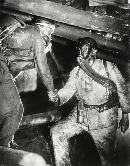 Two Miners, one Wearing Gas Mask, Shaking Hands, on-set of the Film, "Kameradschaft", 1931