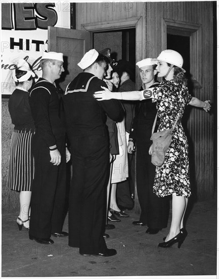 Showgirl Betty Douglas Doubling as Air Raid Warden during WWII, New York City, USA, 1943