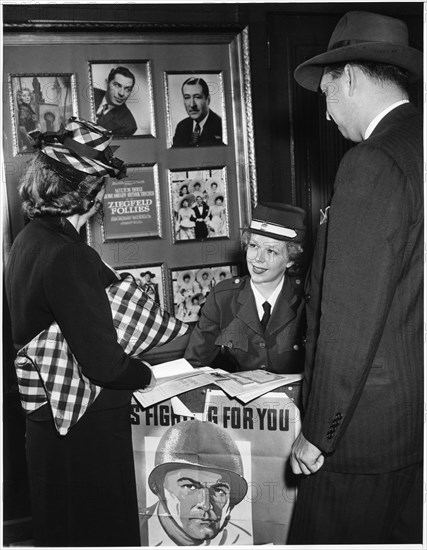 Showgirl Mary Alice Bingham Selling War Bonds and Stamps in Lobby of Winter Garden Theater before her Performance, Broadway, New York City, USA, 1943