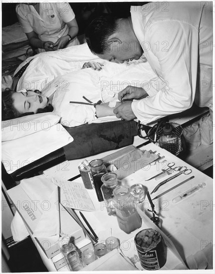 Woman Giving Blood to Contribute to the Red Cross Blood Bank During WWII, New York City, USA, 1943