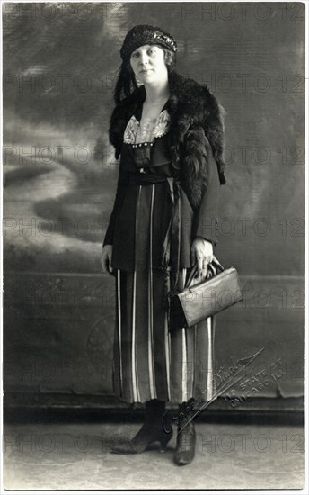 Woman in Striped Dress, Hat and Fur Shawl Holding  Handbag, Portrait, circa 1910