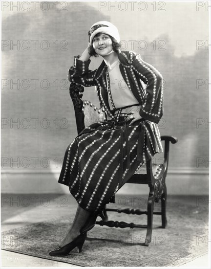 Seated Fashionable Woman in Three-Piece Outfit and Hat, Portrait, circa 1922