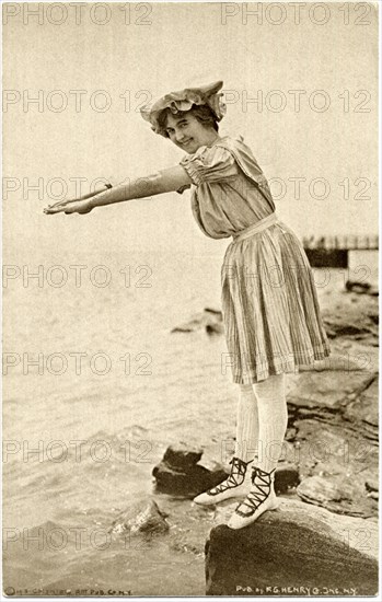 Woman Standing on Rock in Swim Dress and Laced shoes in Diving Position, Postcard, circa early 1900's