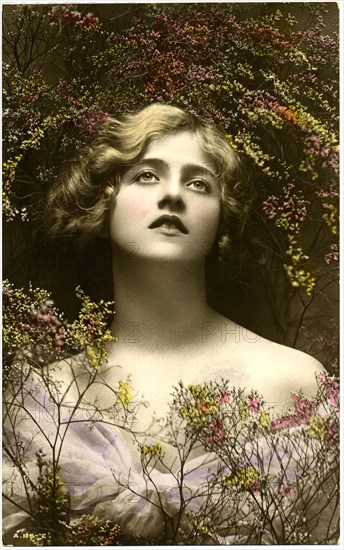 Woman in Pale Purple Dress Looking Up, Surrounded by Tiny Flowers, Hand-Colored Postcard, circa 1910's