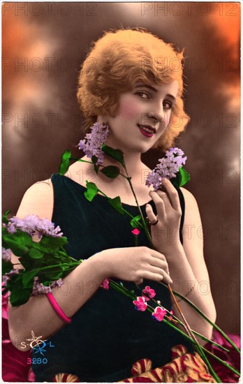 Smiling Woman with Red Hair Holding Flowers, Hand-Colored French Postcard, circa 1927