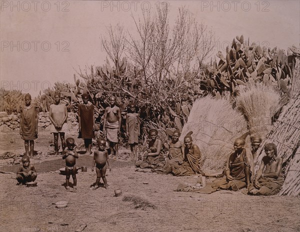 Group of Zulus in Village, Africa, circa 1890