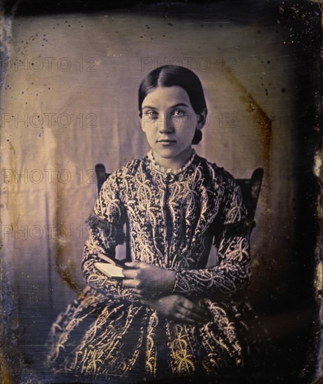 Young Teen Girl Sitting in Chair and Holding Book, Portrait, Daguerreotype, circa 1850's