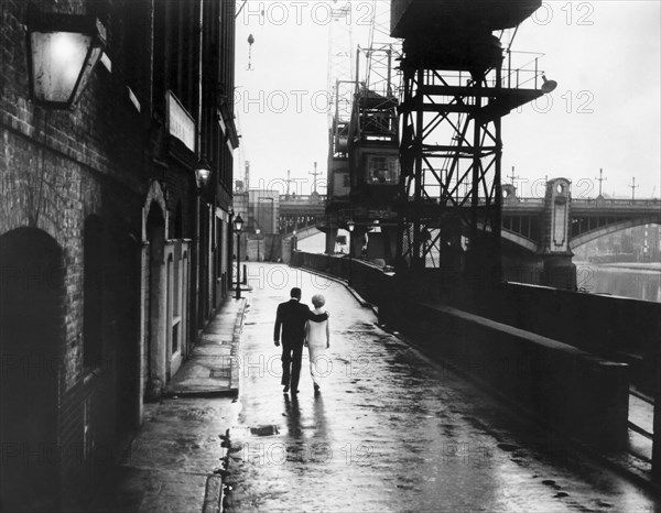 Paul Harris and Marti Stevens Walking Down Street Along River, Rear View, on-set of the Film, "All Night Long", 1962